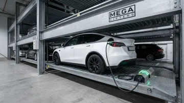 Car lift platform with integrated EV charging connector for stacked vehicles