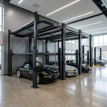 Three cars stacked on a triple parking lift