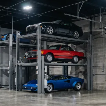 Collector cars stored on private garage lifts