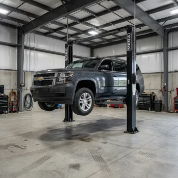 Heavy-duty two post car lift in a garage
