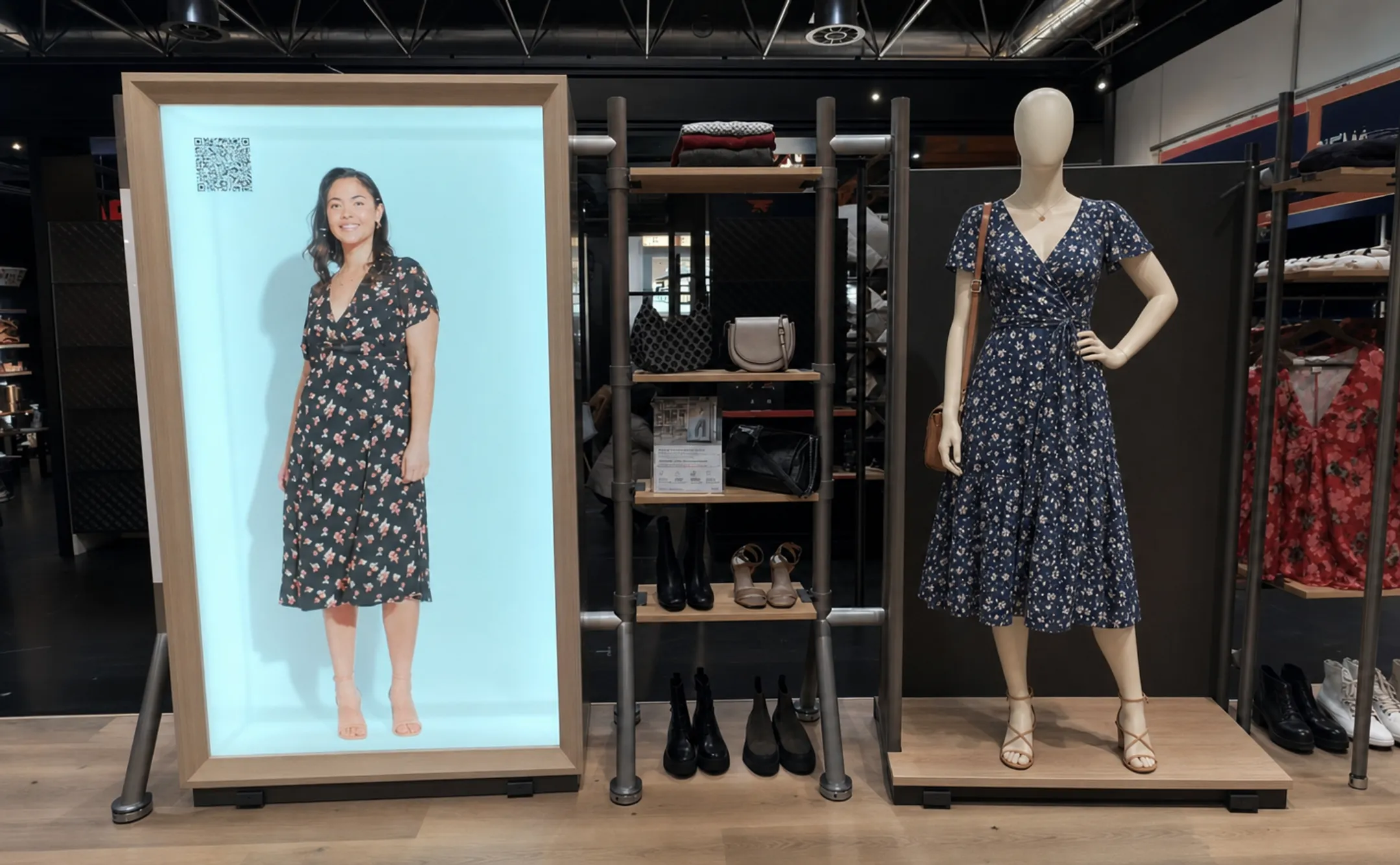 Apparel store mannequin display alongside interactive digital retail kiosk
