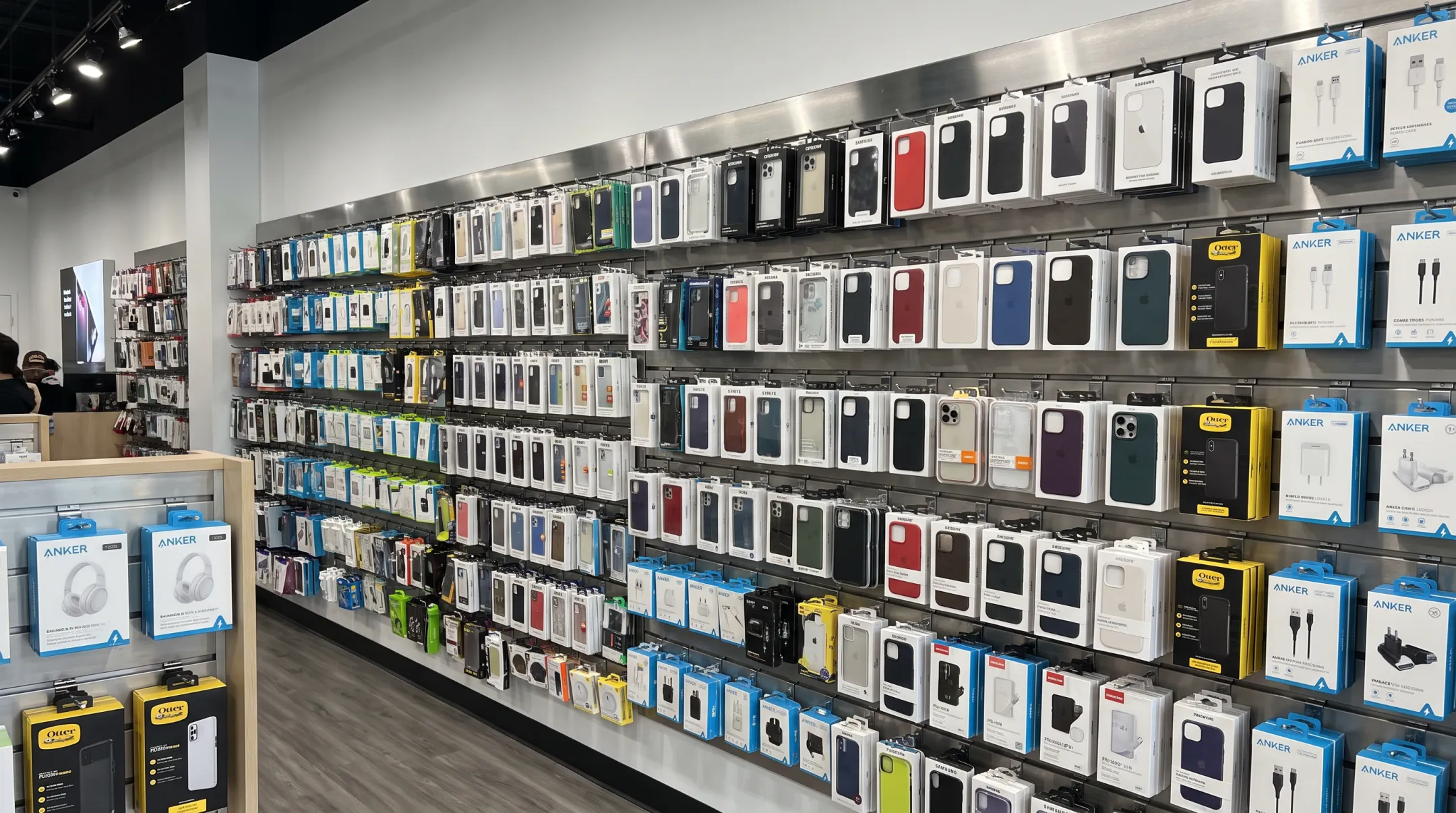 Steel slatwall accessory wall display in modern phone store
