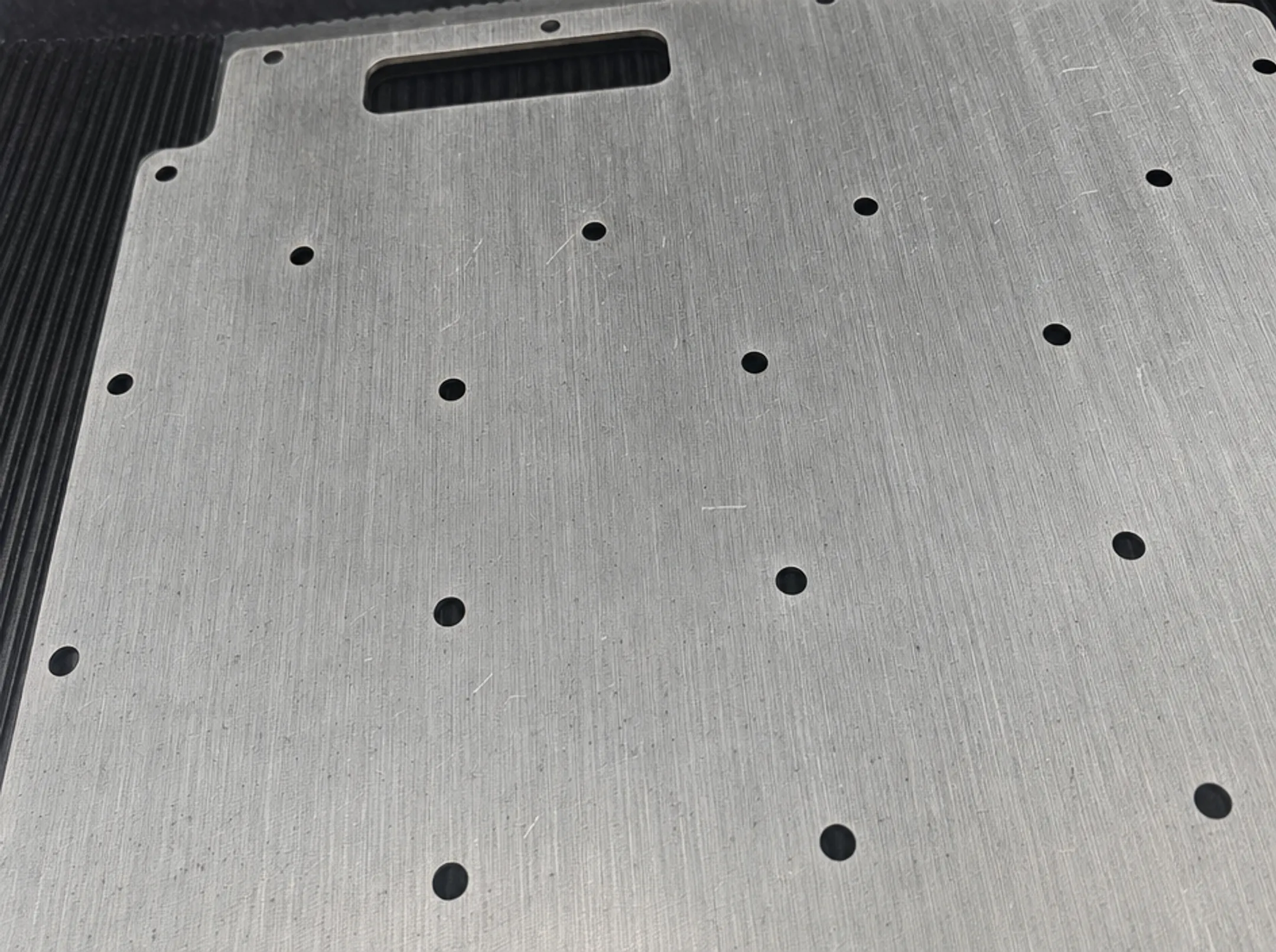 Raw mill finish aluminum surface showing die lines and matte texture
