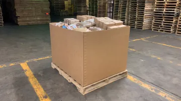 Gaylord bulk container box stacked on warehouse pallet for shipping
