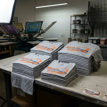 School shirts being organized after screen printing