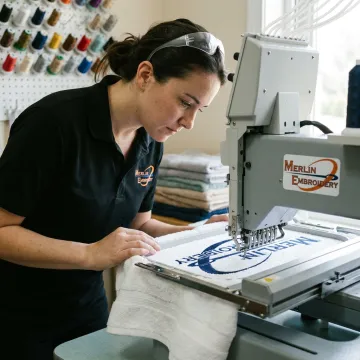 Embroidery machine stitching a custom towel