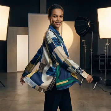 AI-generated fashion model in dynamic pose showcasing clothing in video format