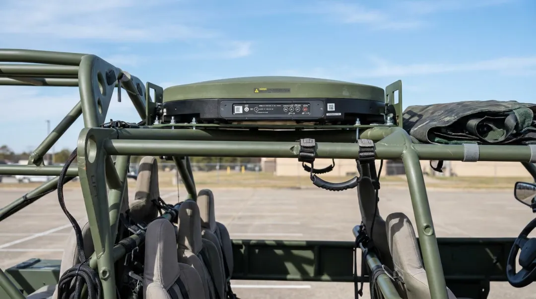 Military tactical vehicle with flat panel antenna mounted for mobile satellite communications