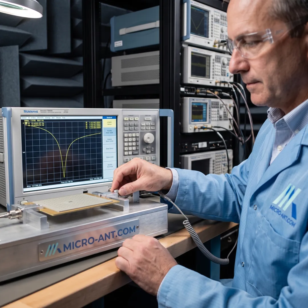Technician reviewing VSWR measurement data on a network analyzer screen