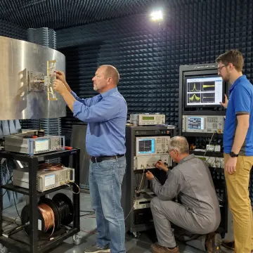 Engineers testing a custom aerospace antenna prototype