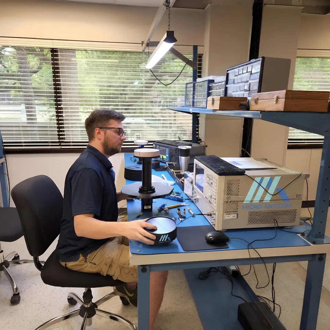 Engineer reviewing RF antenna test data in a lab