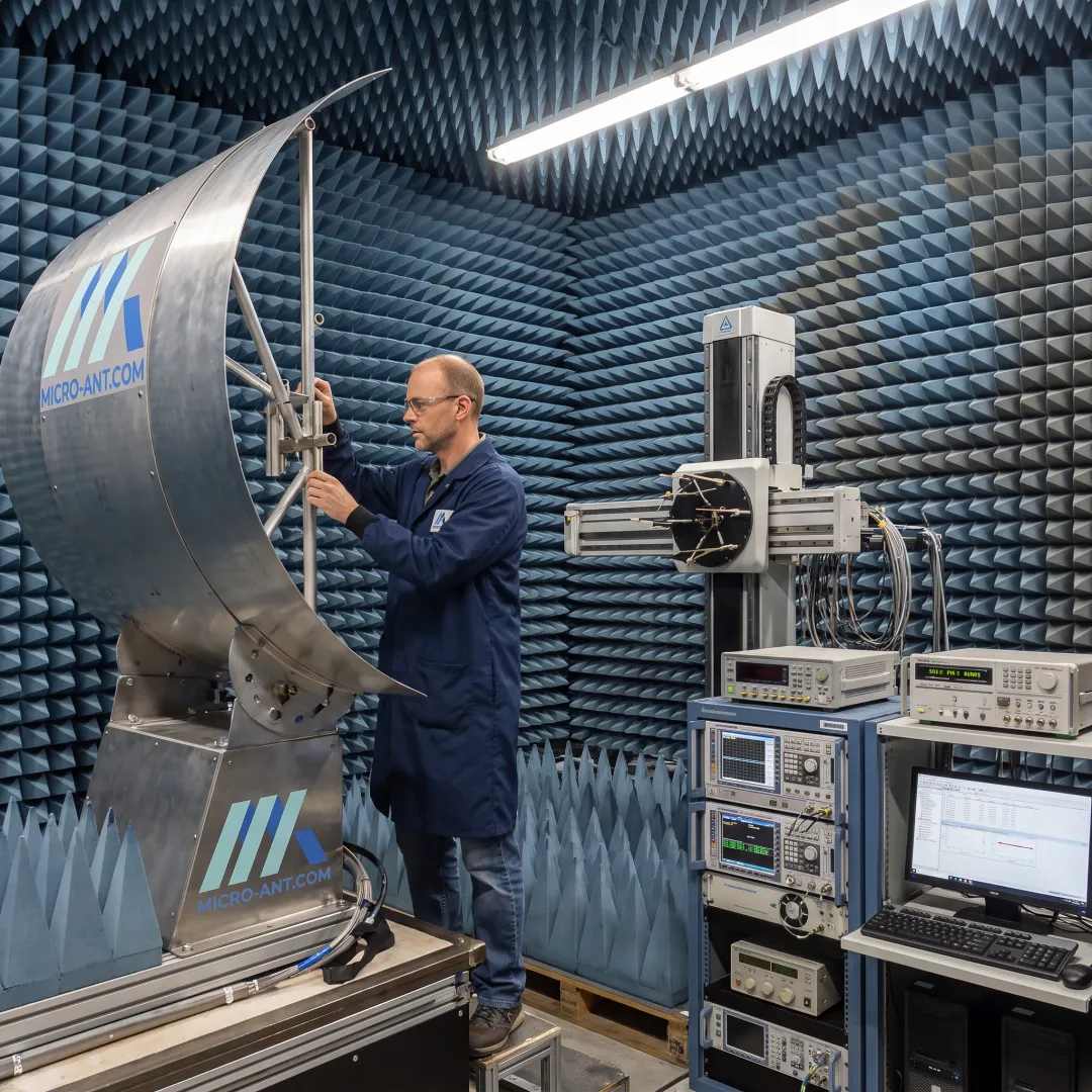 Engineer performing antenna measurement in a near-field chamber