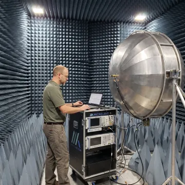 Engineer conducting antenna radiation pattern testing