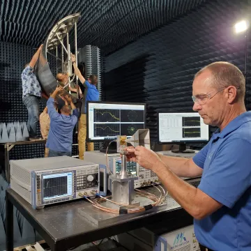 Engineer conducting antenna gain measurement