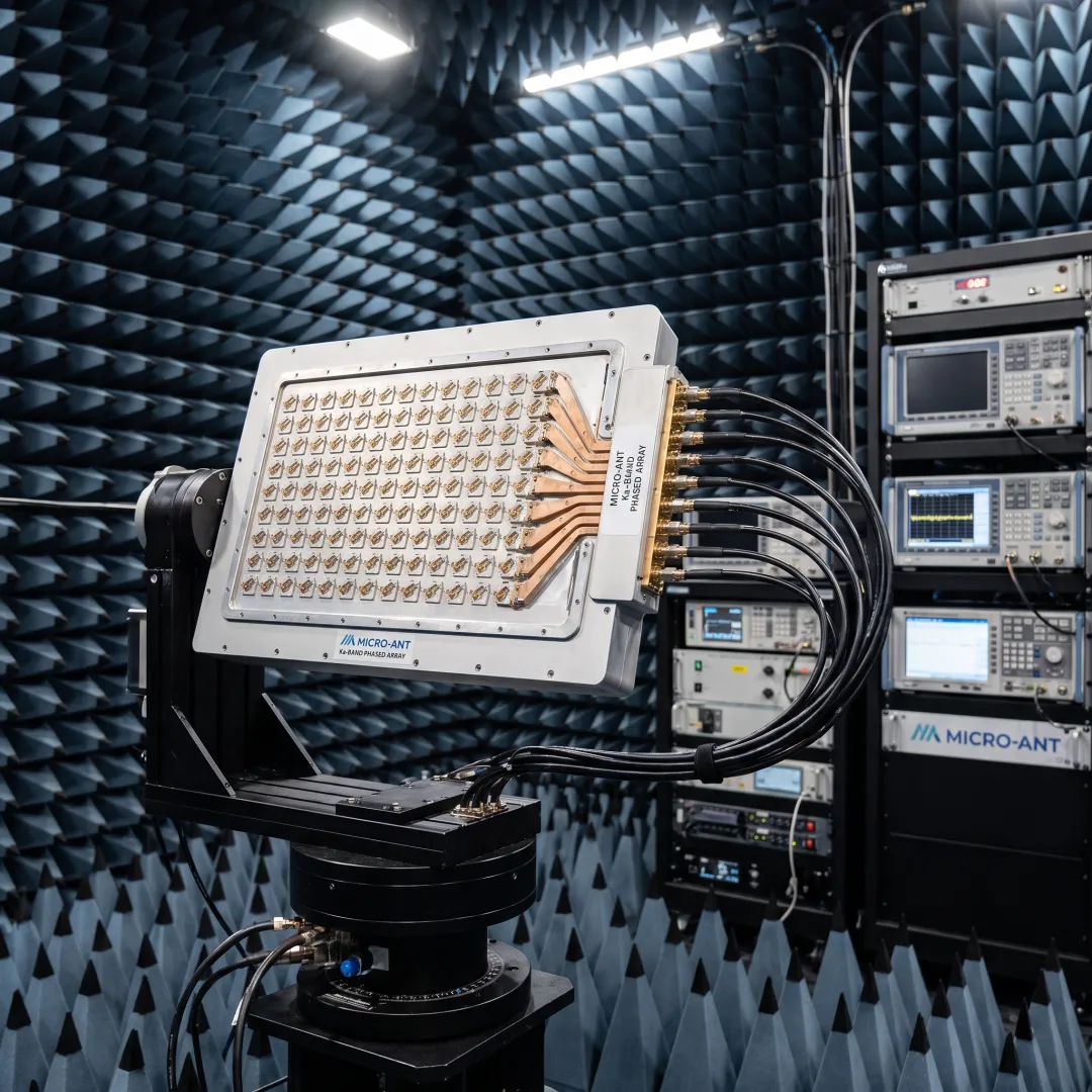 Engineer testing a Ka-band antenna array in an RF testing chamber