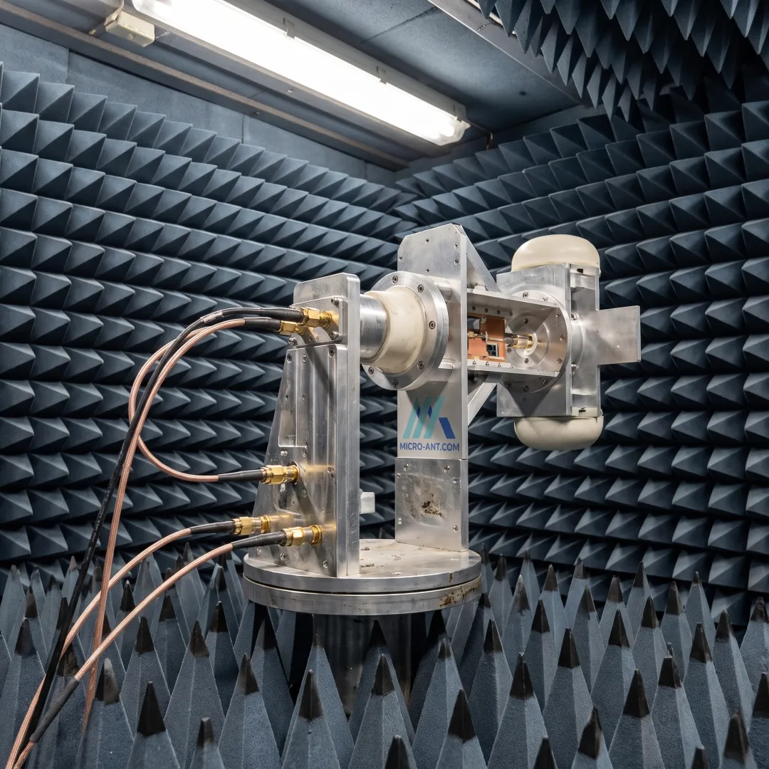 Antenna mounted on positioner inside RF test chamber during characterization