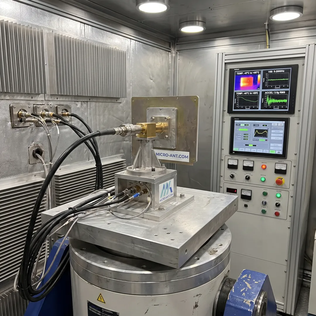 Technician preparing an antenna for environmental test chamber cycling