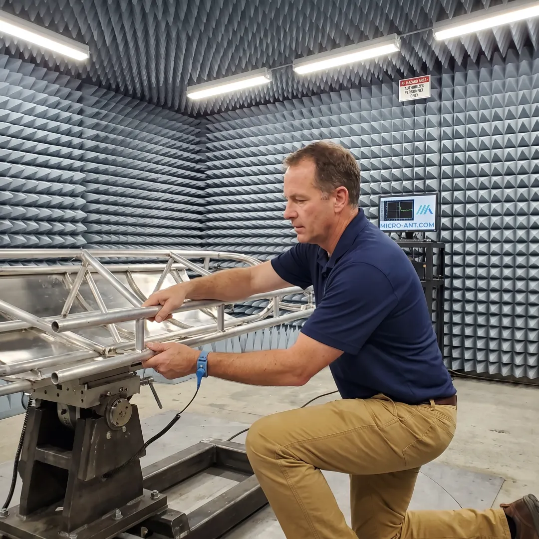 Antenna undergoing qualification testing inside a spherical near-field measurement chamber