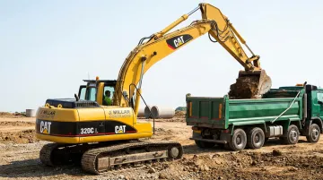 Cat 320 mid-size excavator operating on active commercial construction site