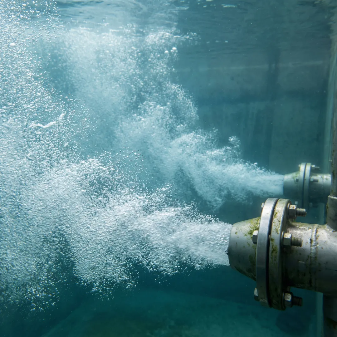 Jet aeration nozzles creating micro-bubbles in wastewater treatment tank