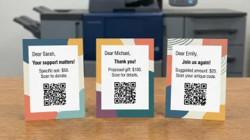 Variable data printing postcard samples showing personalized donor names and unique QR codes