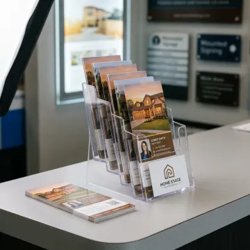 Real estate rack cards displayed on a counter
