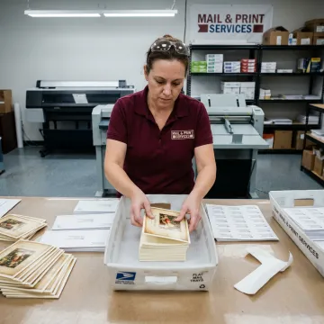 Holiday cards being prepared for mailing