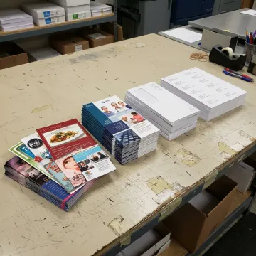 Printed postcards and mail pieces prepared for delivery