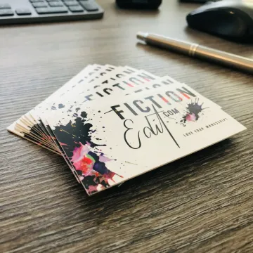 Custom plastic business cards on a desk