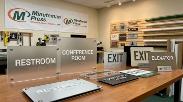 Minuteman Press ADA compliant Braille signage samples on display