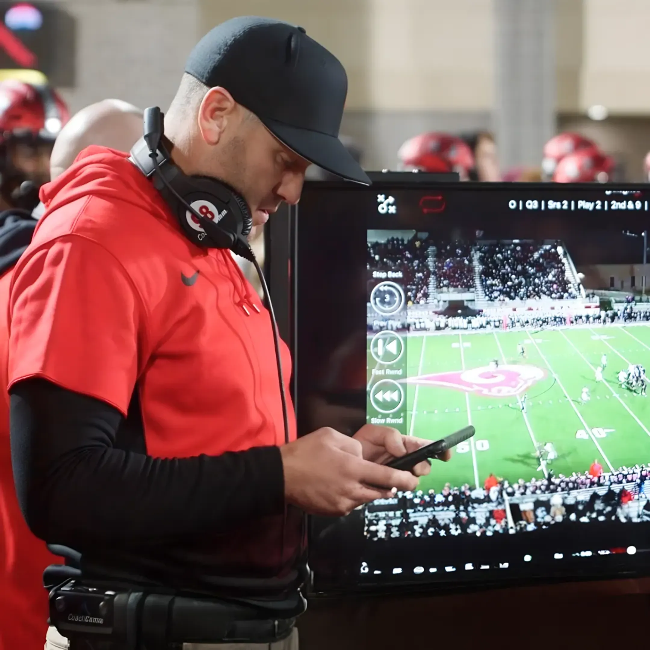 Football coaches using live analytics on tablets