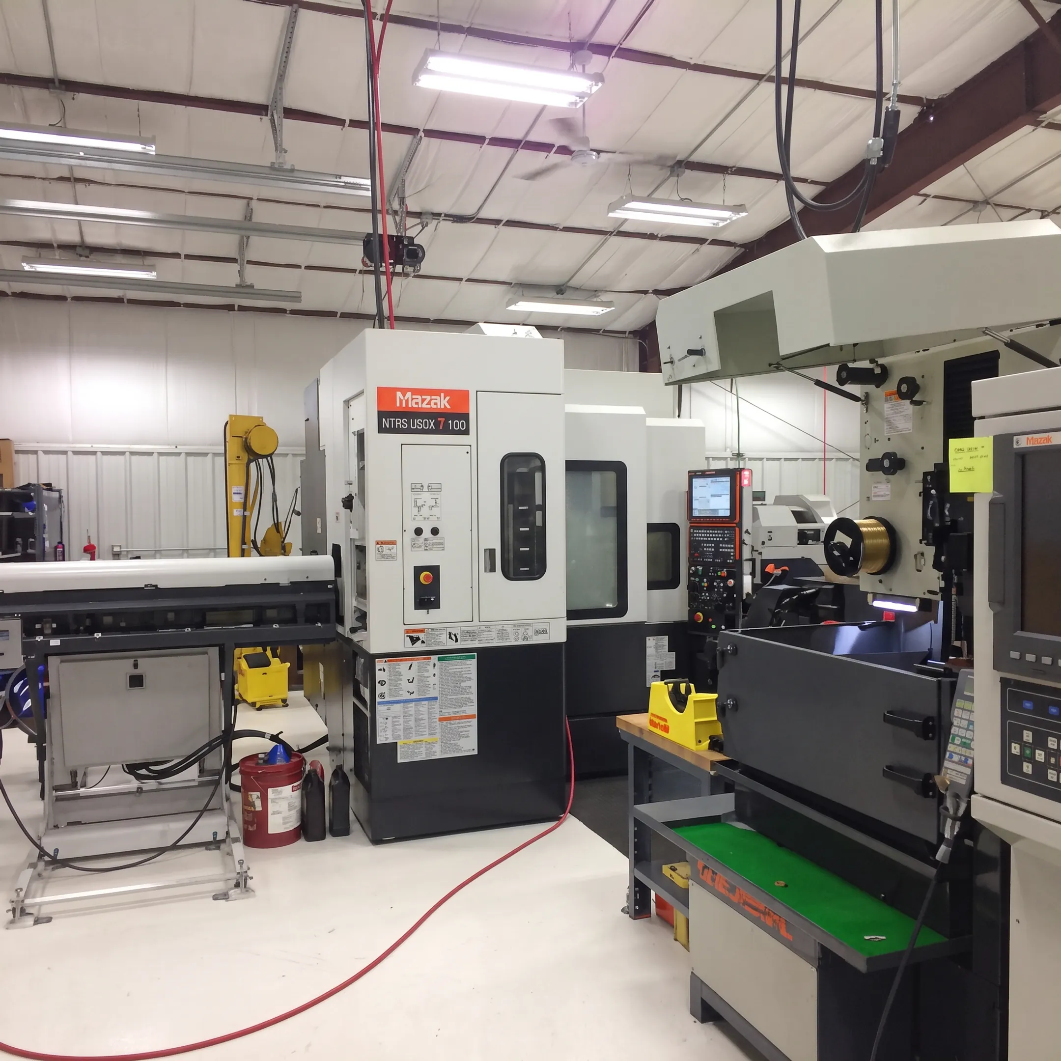 Inspected orthopedic screw components beside precision machining equipment