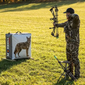 Bowhunter practicing on coyote silhouette target