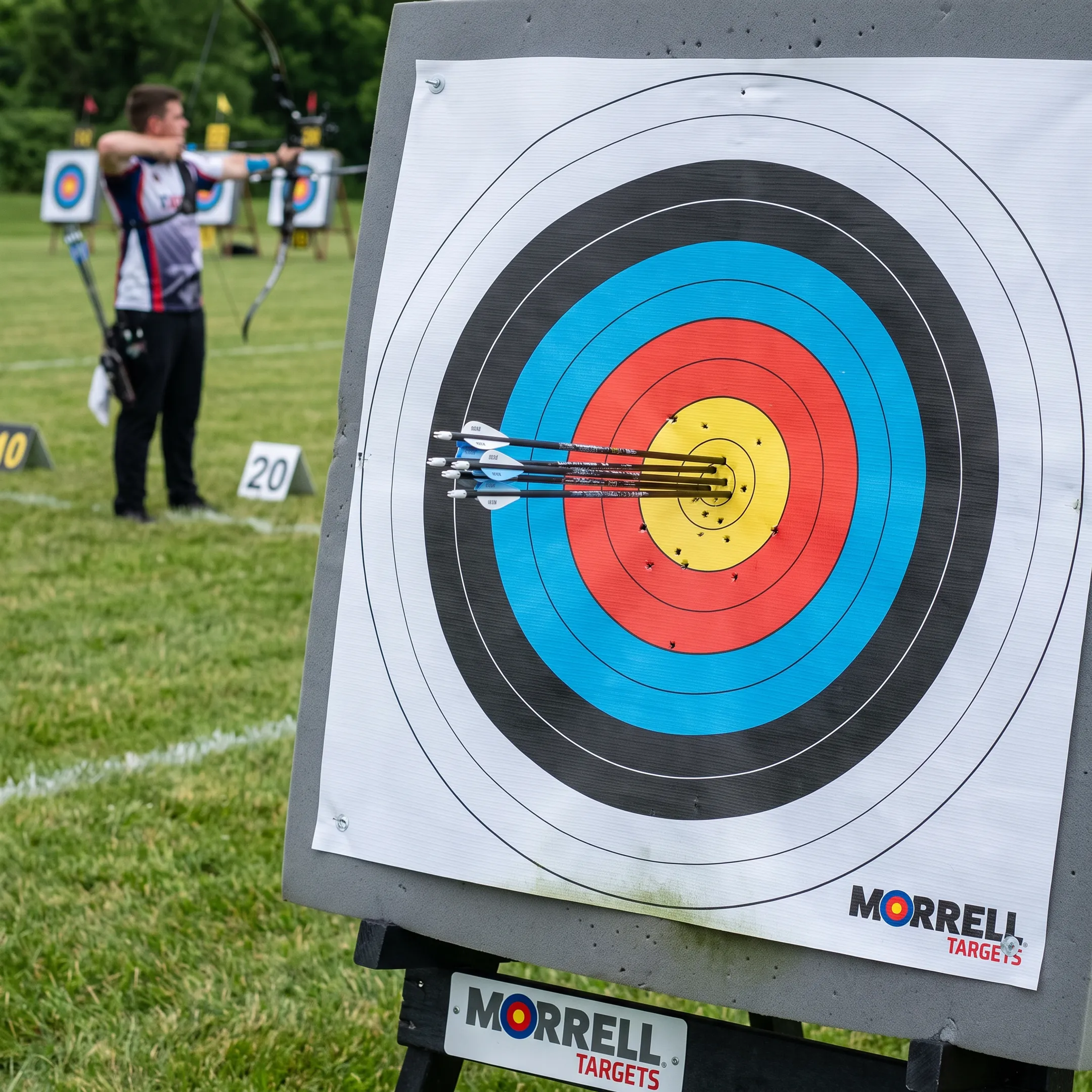 Competitive archer shooting at 80cm tournament target