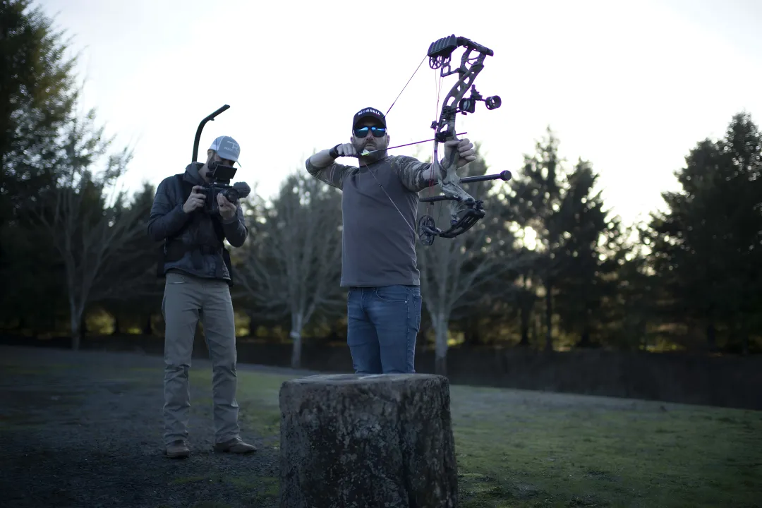 Bowhunter practicing on 3D deer target