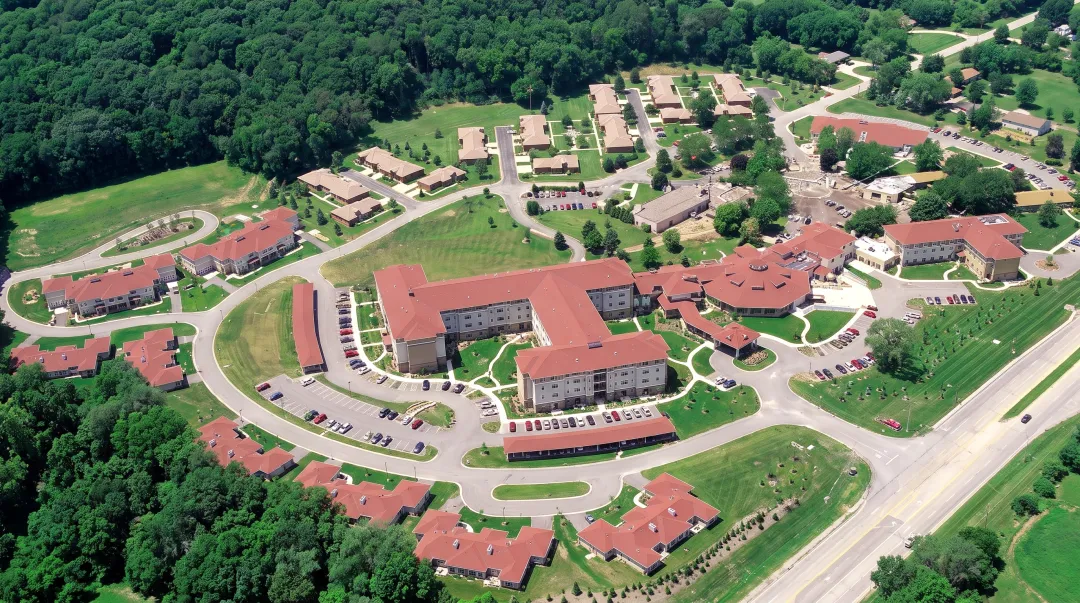 Modern CCRC campus showing multiple buildings for independent living assisted living and skilled nursing