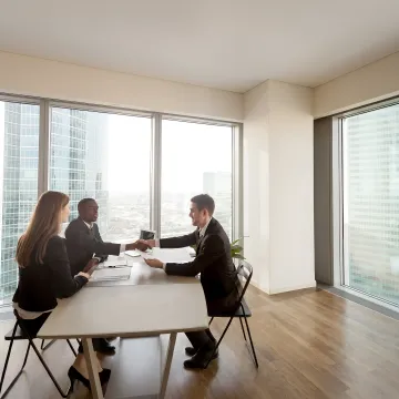 Consultant coaching managers during a workplace training session
