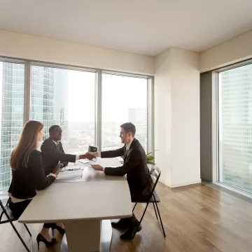 Manager reviewing workplace policies with HR consultant