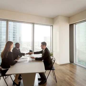 Business leader coaching a manager in an office