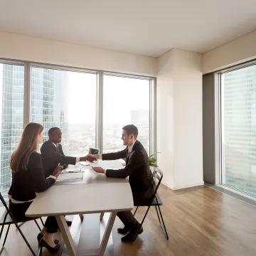 Business leaders reviewing HR compliance strategy