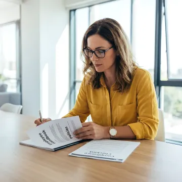 HR consultant reviewing workplace compliance documents