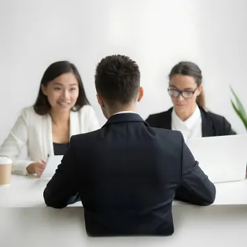 Business leaders discussing employee compensation