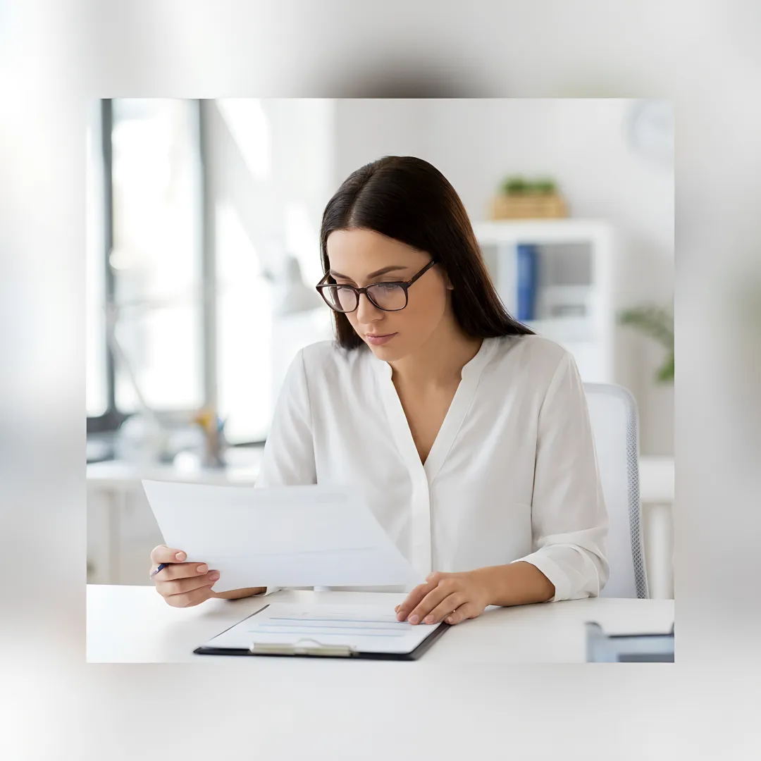 HR consultant reviewing annual compliance documents