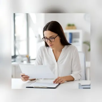HR consultant reviewing annual compliance documents