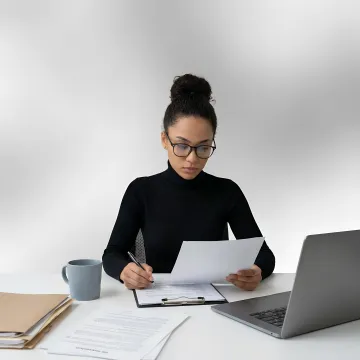 HR professional reviewing workplace investigation documents