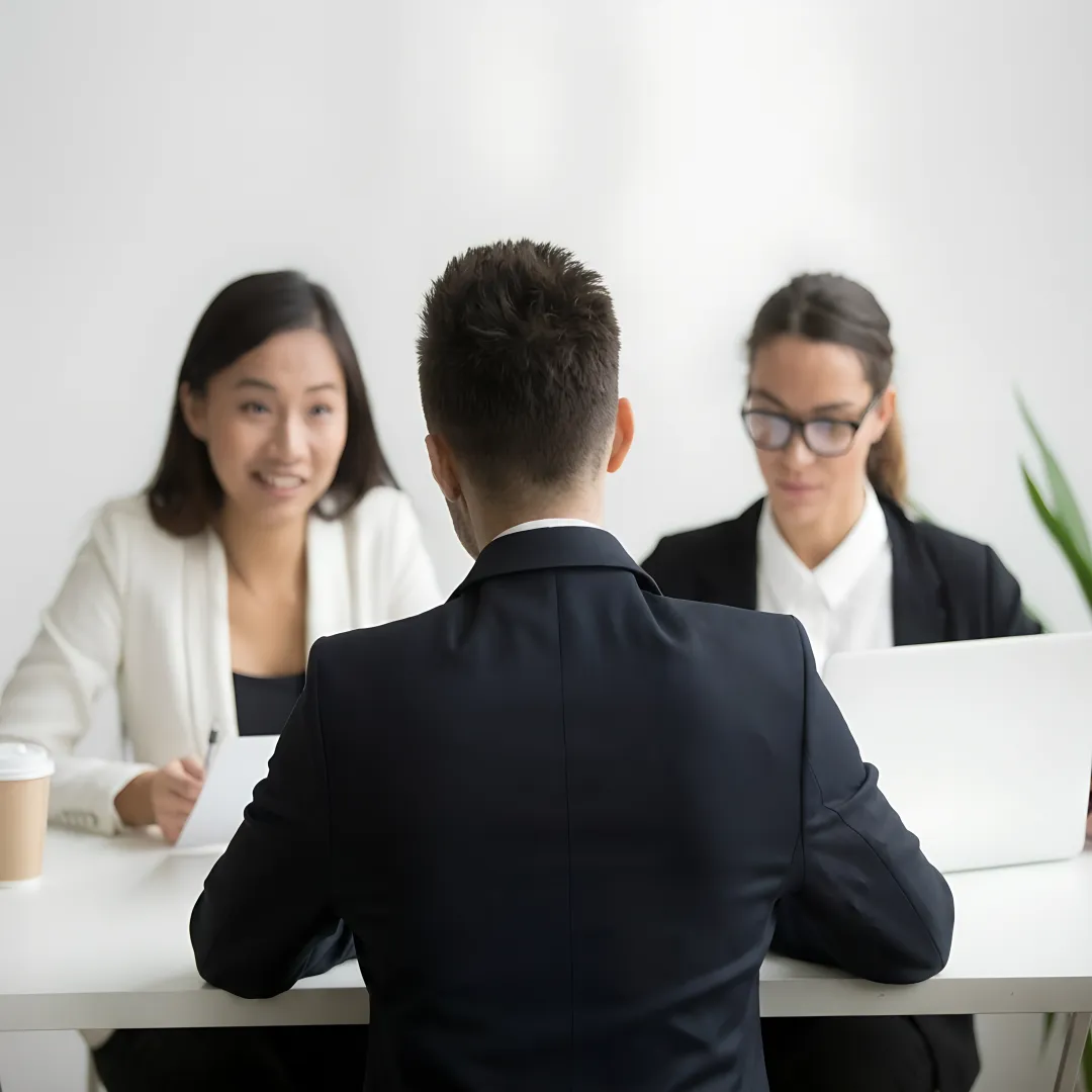 Manager coaching employee during a workplace meeting