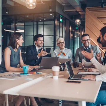 Manager coaching employees during a workshop