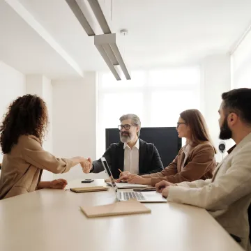 Facilitator coaching managers during a leadership workshop