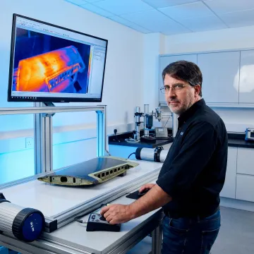 Aerospace engineer reviewing thermal NDT results