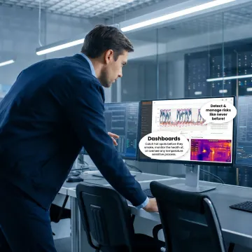 Engineer reviewing transformer monitoring data